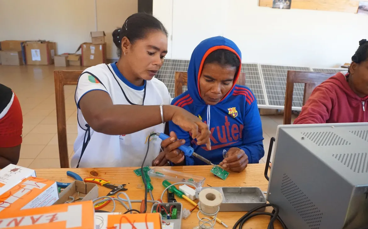 teacher helps student working on a switch area