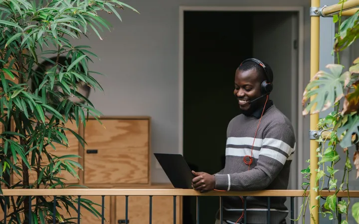 employee on a video call in open office space