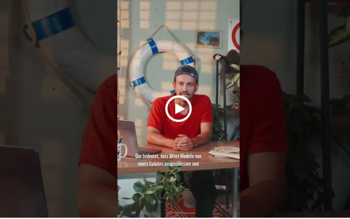 Video host sitting at desk 