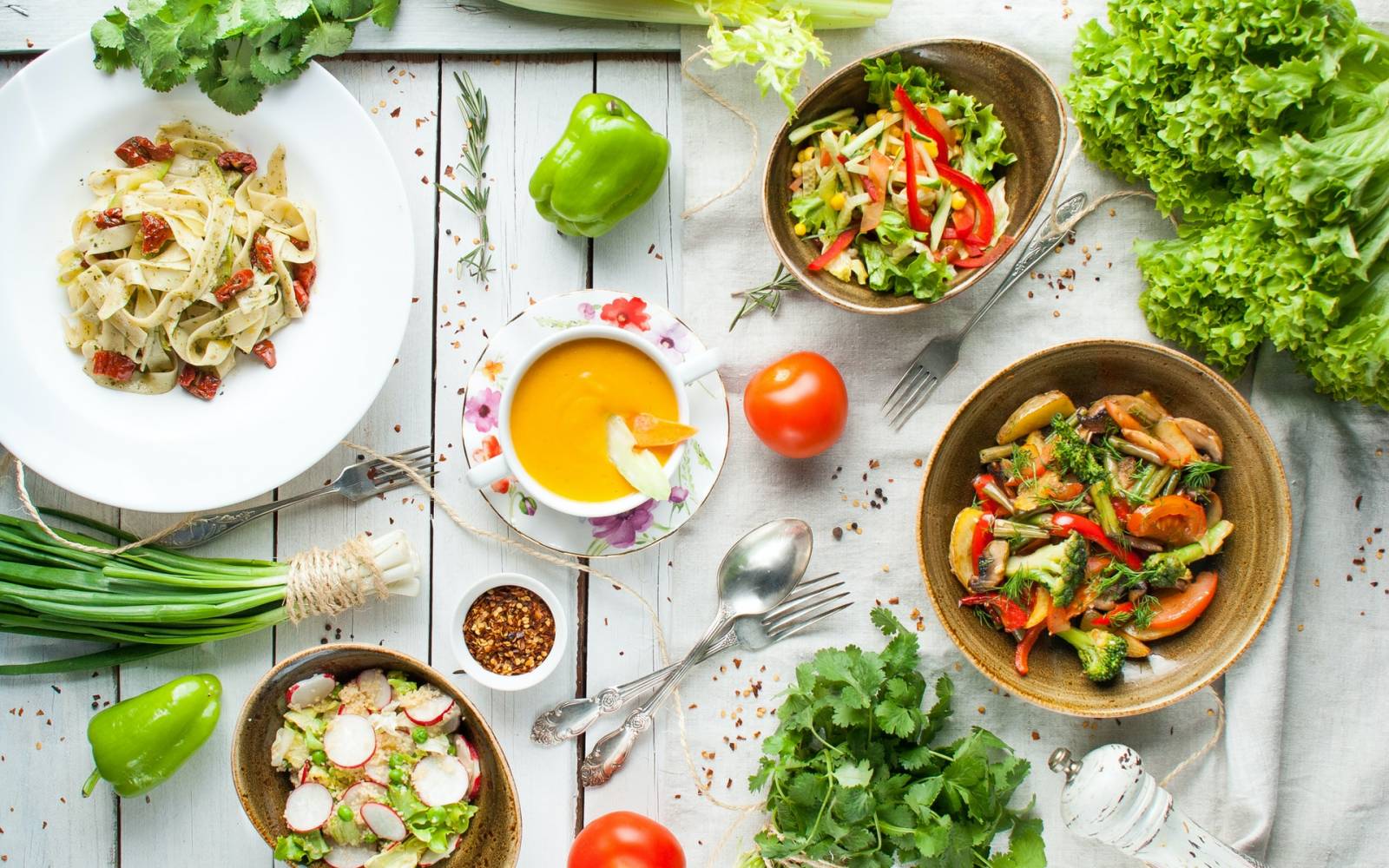 dinner table set with vegan dishes