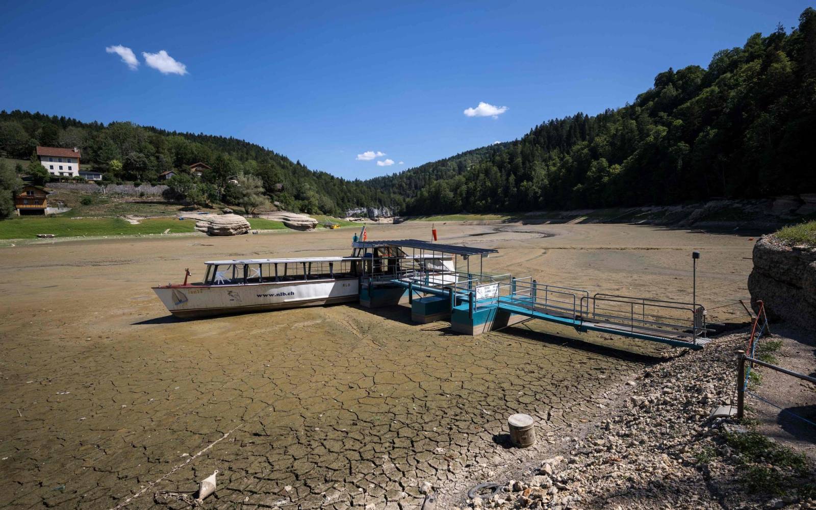 Boat in dried up lac des Brenets