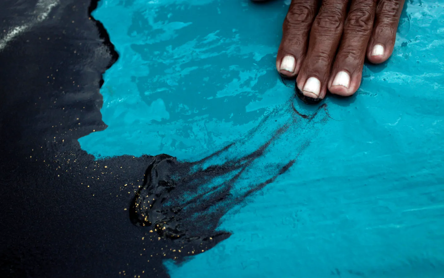 Gold dust glitters from the dark mud
