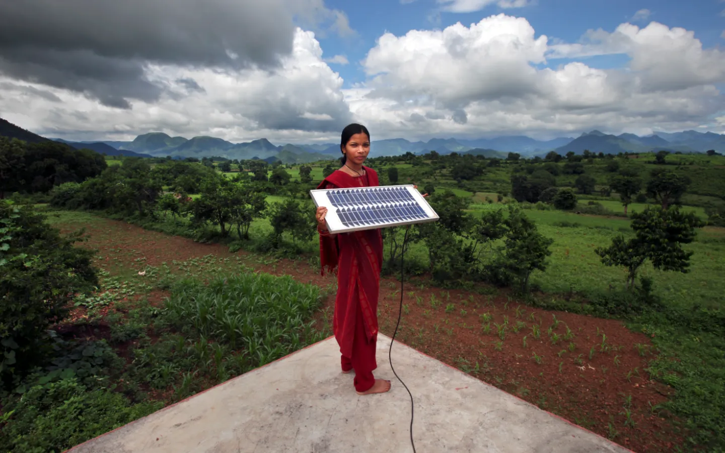 Girl with solar panel credit Abbie Trayler Smith