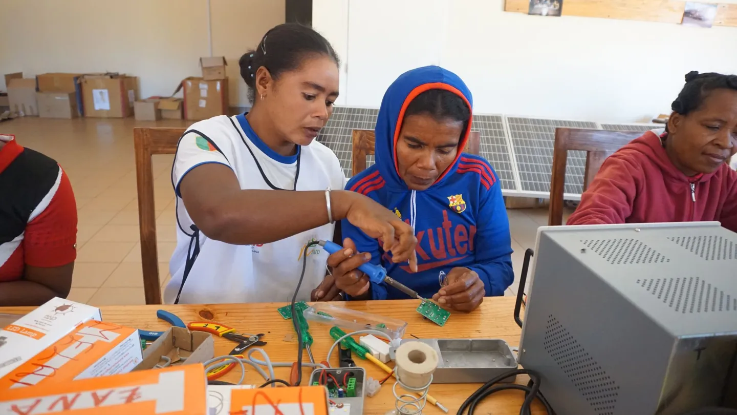 teacher helps student working on a switch area