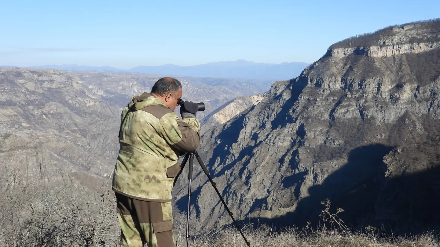 man watching out for leopards